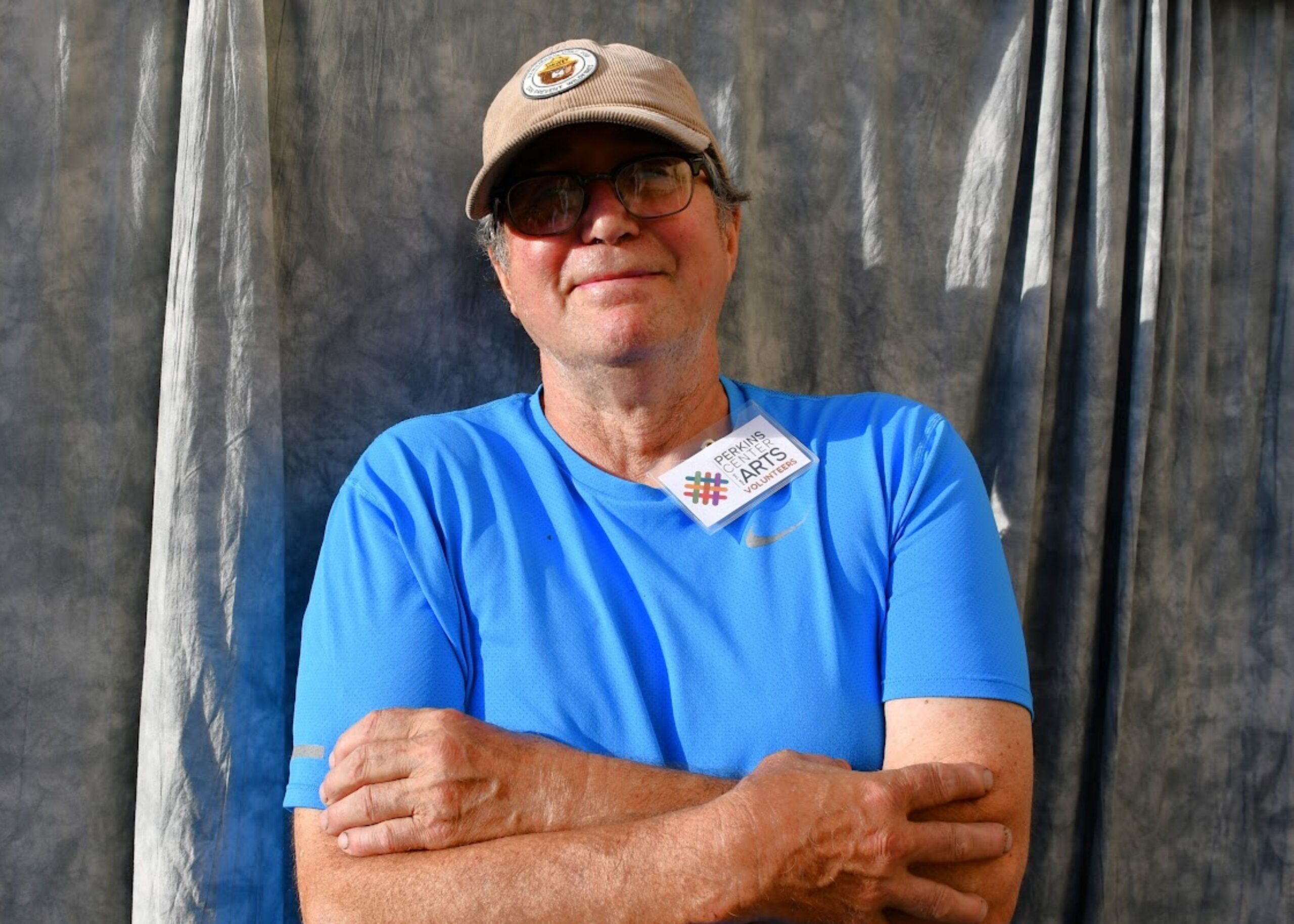 Smiling volunteer wearing a name tag