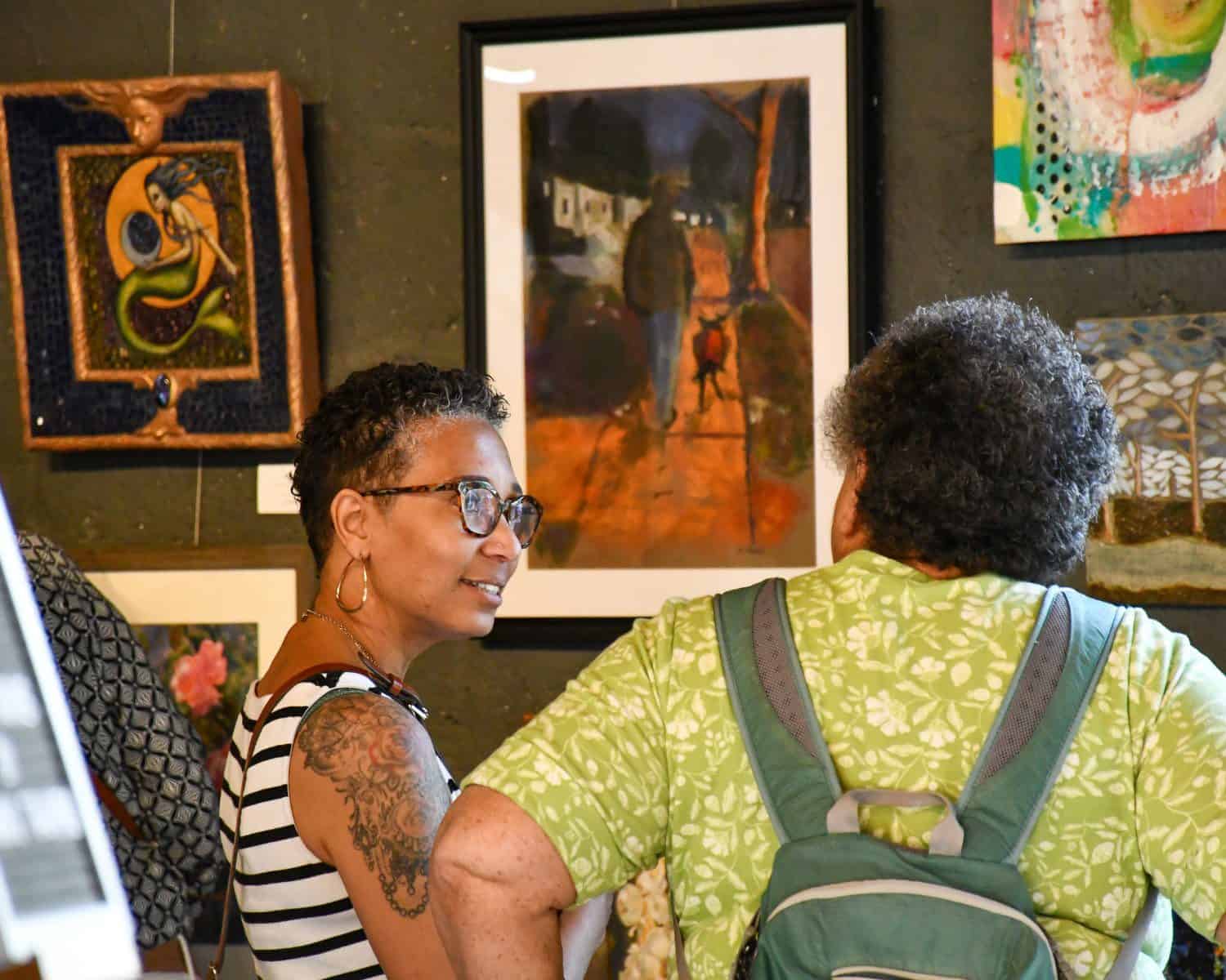 Visitors looking at artwork in a Perkins gallery