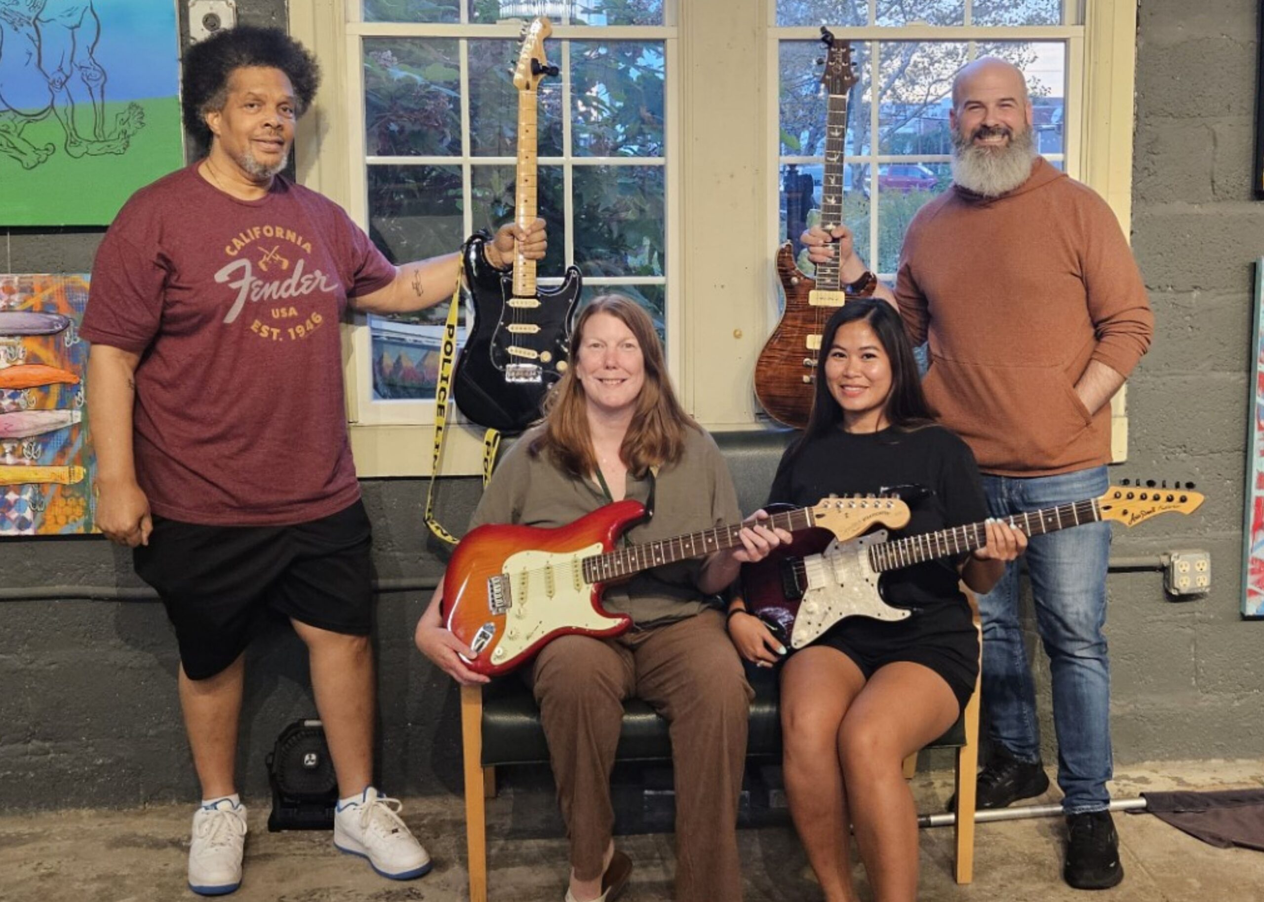 Volunteers and musicians with guitars